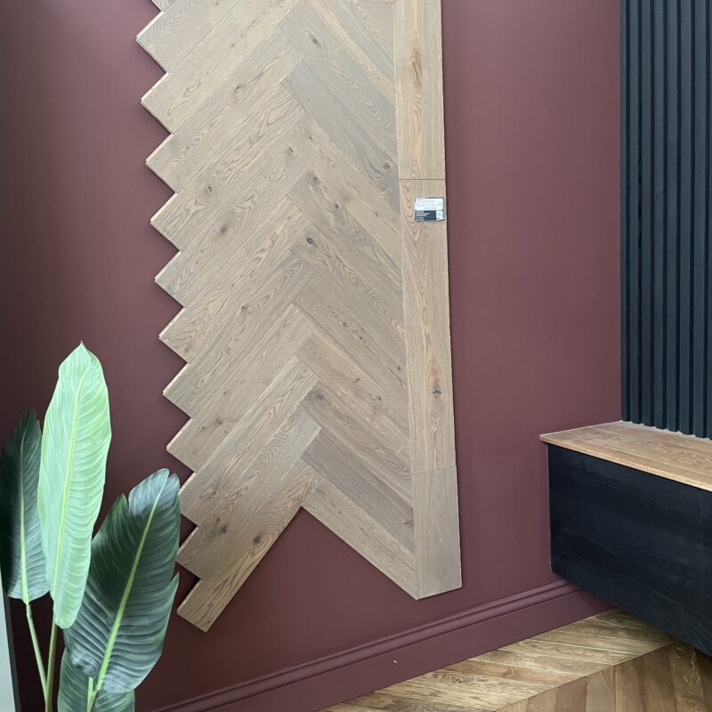 Graphite Grey Engineered Herringbone Flooring from Grain & Groove, featuring deep grey tones, a smooth oiled finish, and a classic herringbone pattern for a modern and elegant look